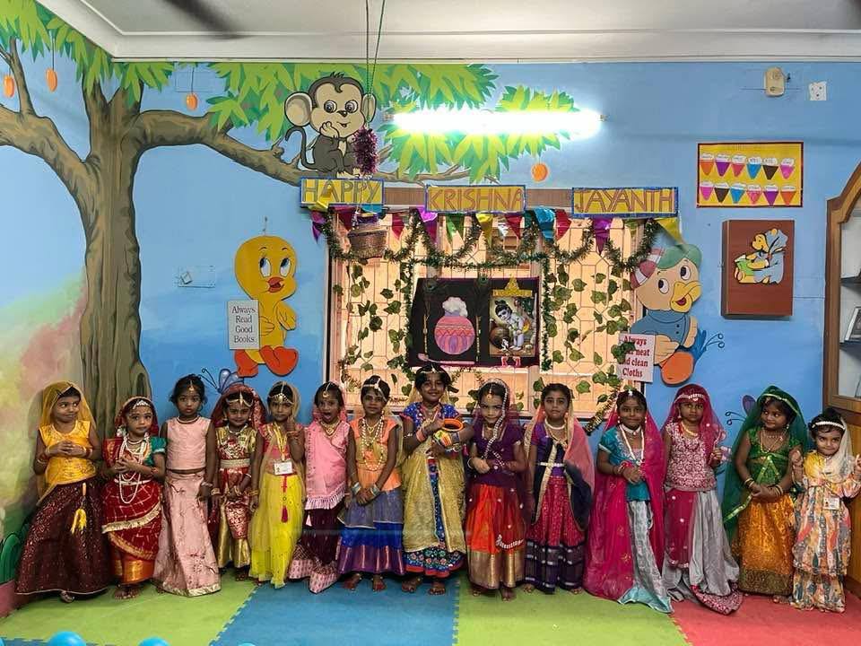 Girls in traditional dress celebrating Krishna Jayanthi at Mrs Reena's Cocoon Play School, Ramapuram